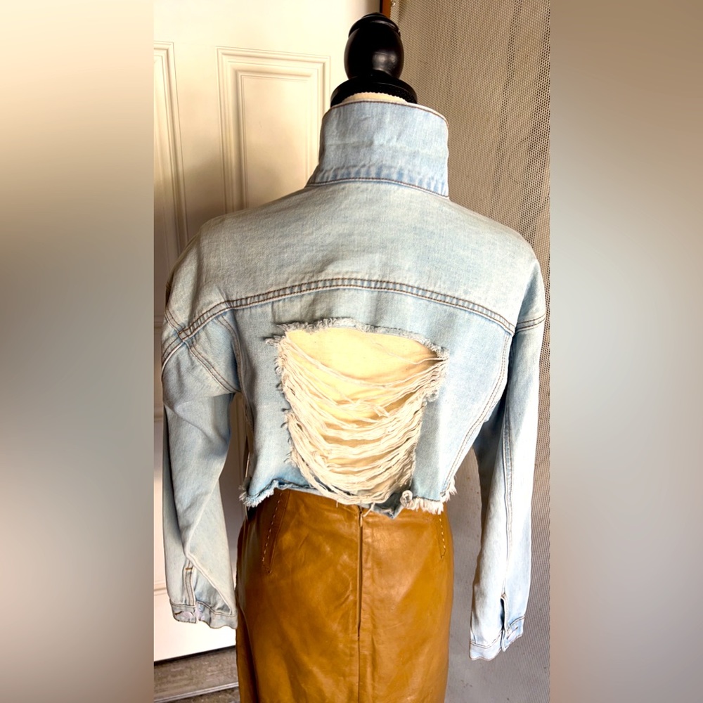 Distressed denim jacket